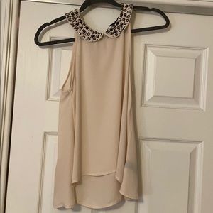 Cream sleeveless blouse